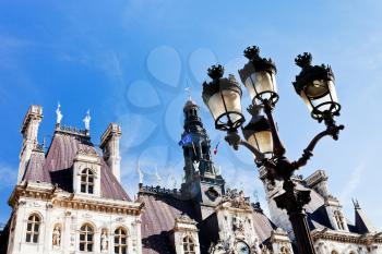 Parisian lantern and Hotel de Ville (City Hall) in Paris, France