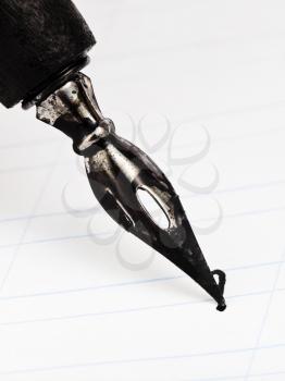 dot letter I with metal nib of drawing pen by black ink close up