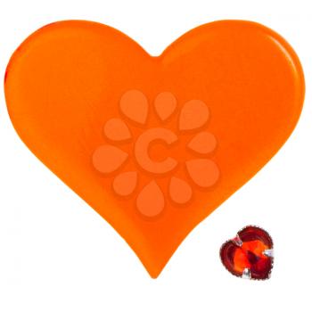big orange plastic heart and small red glass heart isolated on white background