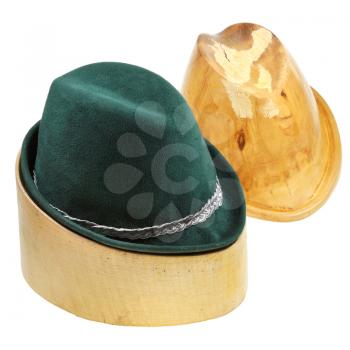 tyrolean felt hat on linden wooden hat block and additional hat block isolated on white background