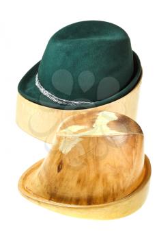 hunting felt hat on linden wooden hat block and additional hat block isolated on white background