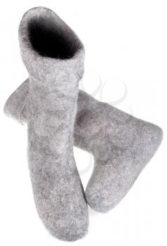 two grey felt boots isolated on white background