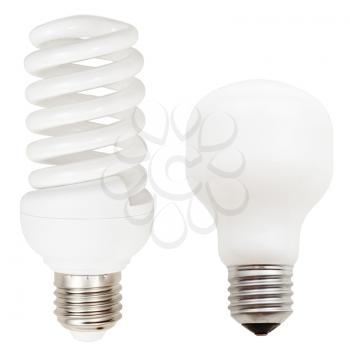 two lamps - incandescent and helical compact fluorescent light bulbs isolated on white background