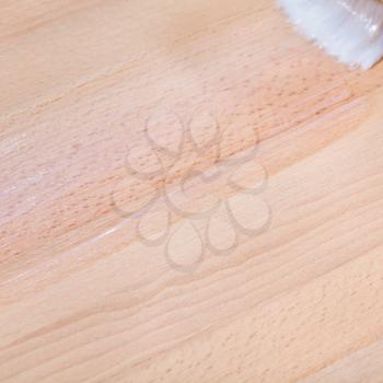layer of clear varnish on surface of beech worktop