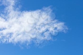 one small white cloud in italian blue sky in autumn