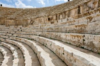 stone seats in antique Large South Theatre , Jerash in Jordan