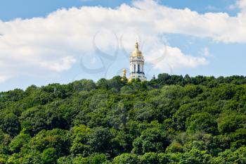 bell tower of Kiev Pechersk Lavra under green park