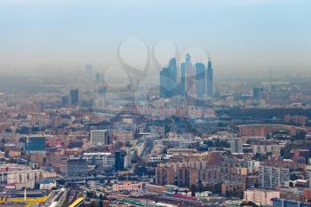 above view on Moscow City and cityscape in smog autumn day, Russia