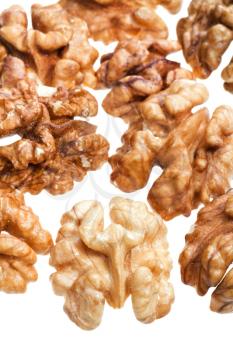 few peeled walnut kernels isolated on white background close up
