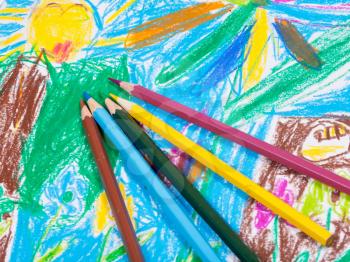 several colored pencils on children draw picture background