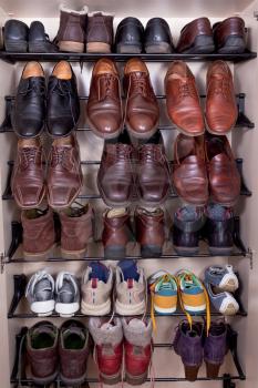shoes cabinet with used leather male slippers