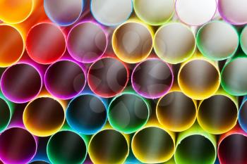 abstract background from pied plastic drinking straws close up