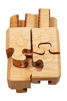 assembling of three dimensional wooden mechanical puzzle close up isolated on white background