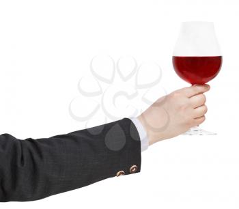 side view of red wine glass in businessman hand isolated on white background