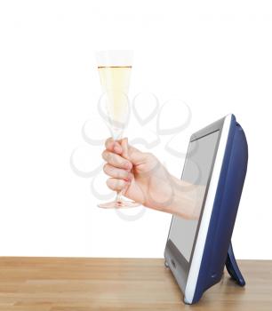 hand raising glass with champagne leans out TV screen isolated on white background