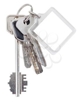 bunch of house keys on steel ring and keychain isolated on white background