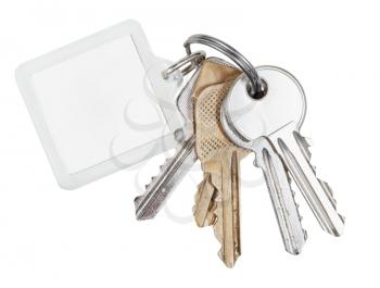 several door keys on ring and keychain isolated on white background