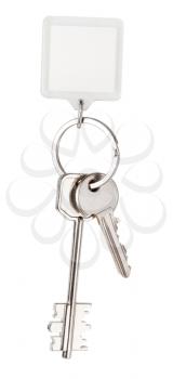 two house keys and square keychain on ring isolated on white background