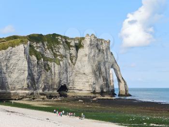 view of cliff with arch on english channel beach of etretat cote d'albatre, France