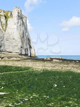 cliff with arch on english channel beach during low tide of Etretat cote d'albatre, France