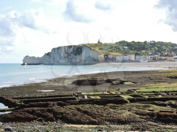 Etretat village and cliff on english channel beach of cote d'albatre, France