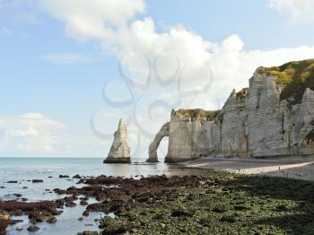 natural cliffs on english channel beach during low tide of Etretat cote d'albatre, France