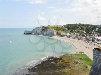view of Etretat resort village on english channel beach of cote d'albatre, France