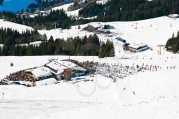 view of mountain village and downhill ski slopes in Saalbach Hinterglemm region, Austria