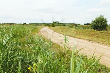 country road between agrarian fields in caucasus region