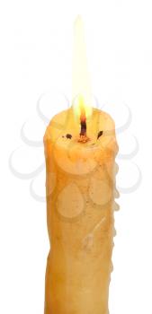 burning stearin candle close up isolated on white background