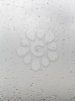 background from rain drops on window pane close up