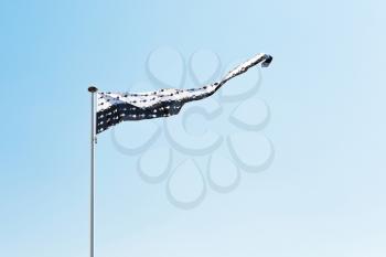 flag of Brittany in departement of Loire-Atlantique, France with blue sky background