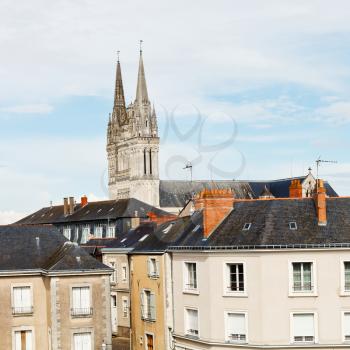 view of urban houses and Saint Maurice Cathedral in Angers, France