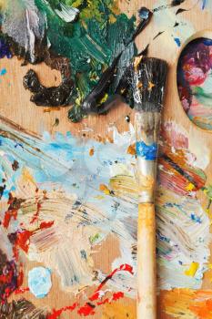 paintbrush on wooden used oils artistic palette