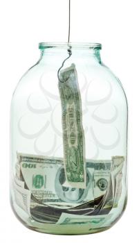 catching saving dollars from glass jar isolated on white background