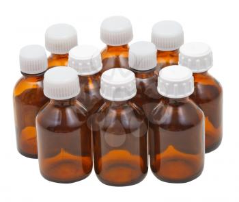 many small closed brown glass oval pharmacy bottles isolated on white background