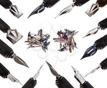 many nib pens in wooden holders close up isolated on white background