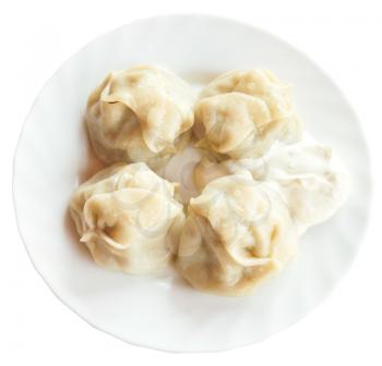 top view of manti dumpling on white plate isolated on white background