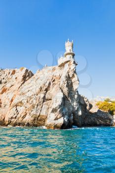 Aurora crock with Swallow's Nest castle on Southern Coast of Crimea