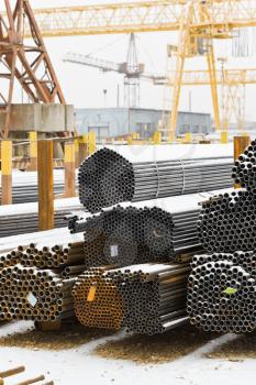 storing of steel pipes in outdoor warehouse with gantry cranes