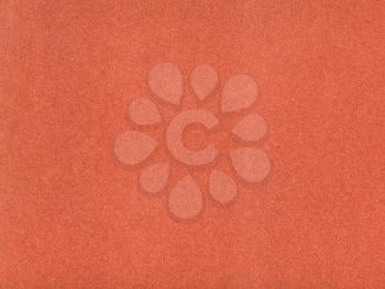 background from sheet of red brown color velvet paper close up