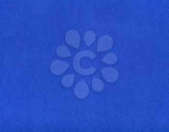 background from sheet of dark blue color velvet paper close up
