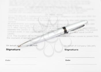 silver pen on signature page of sales contract
