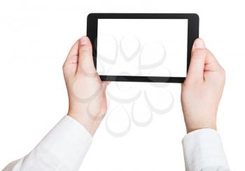 businessman hands holding touchscreen pc with cut out screen isolated on white background