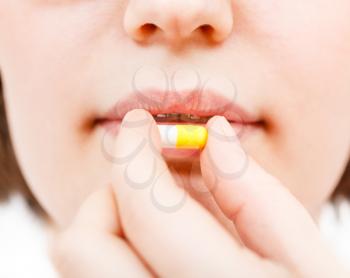 patient takes pilule close up