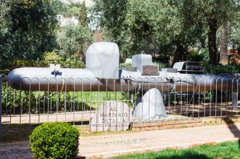 TAORMINA, ITALY - APRIL 3, 2015: memorial to Italian seamen installed шт 1993 in urban park. The monument is made from a restored in 1991 the old submarine - maiale manned torpedo (Human torpedo)