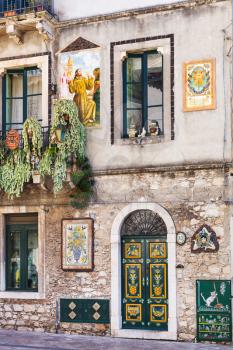 TAORMINA, ITALY - APRIL 3, 2015: traditionally decorated wall of urban house in Taormina town, Sicily.