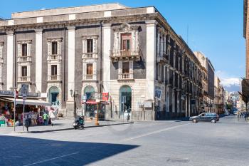 CATANIA, ITALY - APRIL 5, 2015: street via Etnea and view Etna volcano in Catania, Sicily, Italy. Etnea is the main street of historical center of Catania, it is about three kilometers long.