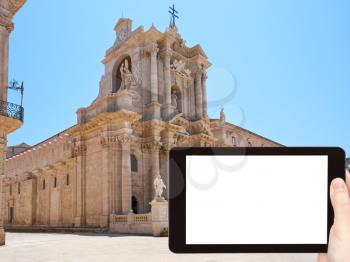 travel concept - tourist photograph baroque style Piazza Duomo and Cathedral in Syracuse, Italy on tablet pc with cut out screen with blank place for advertising logo