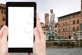 travel concept - tourist photograph Piazza della Signoria and Fountain of Neptune in Florence on tablet pc with cut out screen with blank place for advertising logo